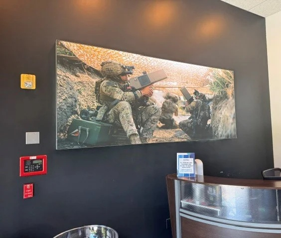 Custom SEG lightbox featuring military aviation imagery adds a distinctive visual display to the DZY