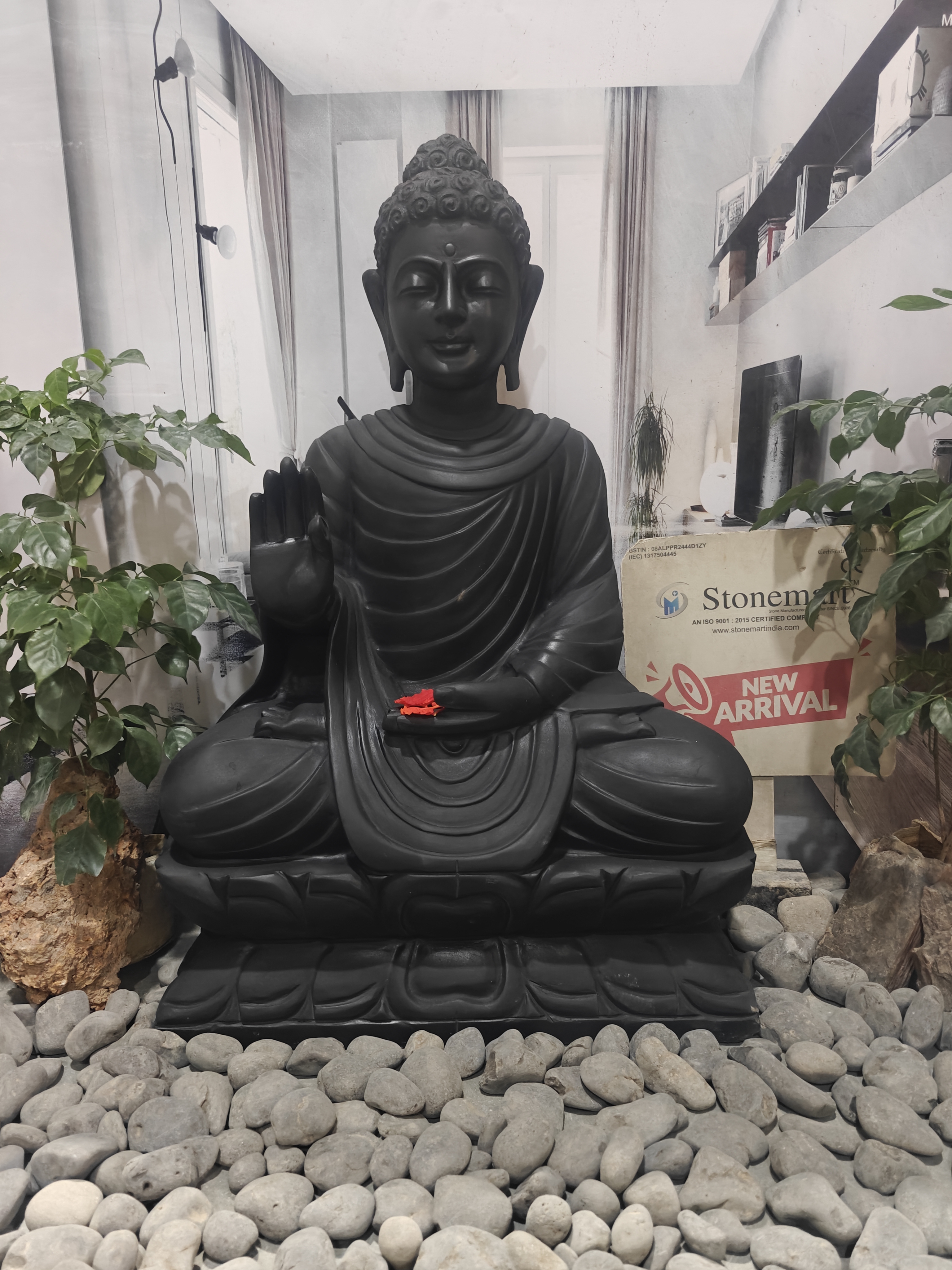 black stone buddha statue in Abhaya Mudra by stonemart