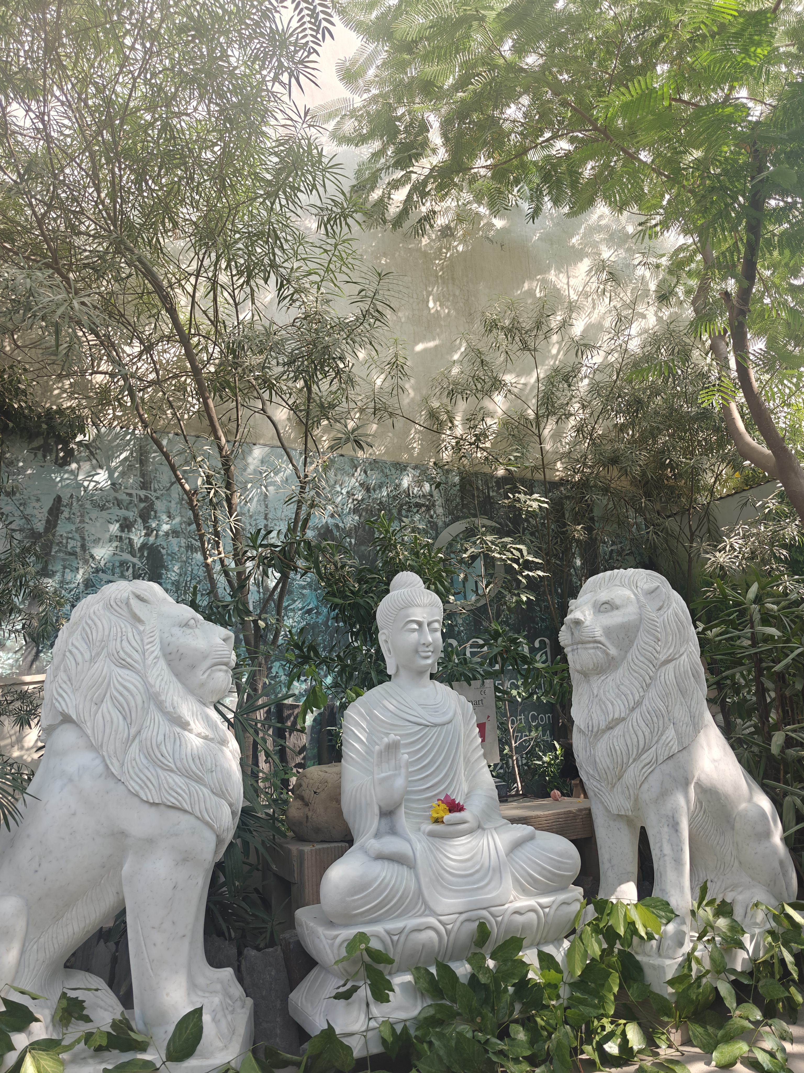 Buddha statue with lions by Stonemart
