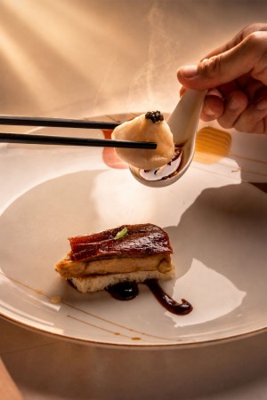 Kurobuta pork Xiao Long Bao with pan-seared foie gras, crispy duck skin and toasted brioch