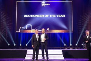 James Pratt on stage accepting his award