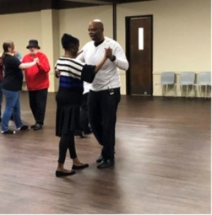 Dr. Green and Estraletta utilize social dancing to bring different people together in February