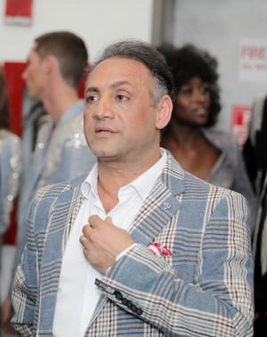 Designer Elie Balleh in the midst of his runway show