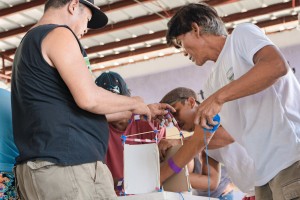 Margaha (right) participated in a game that tests people in building disaster-proof homes.
