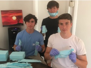 R to L, Brandon Domaceti, Devon Robins and Sam Martinelli make masks
