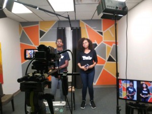 Cofounders Andric J. Copeland and Jocelyn Johnson prepare for TV interview