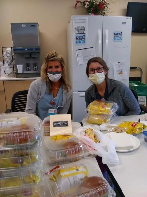 Frontline workers enjoying there donated meals by Clear Choice Windows & More Inc.