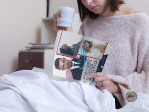 young woman reading-a-book-while-drinking-a-tea-in-her-bed-mockup-a14300