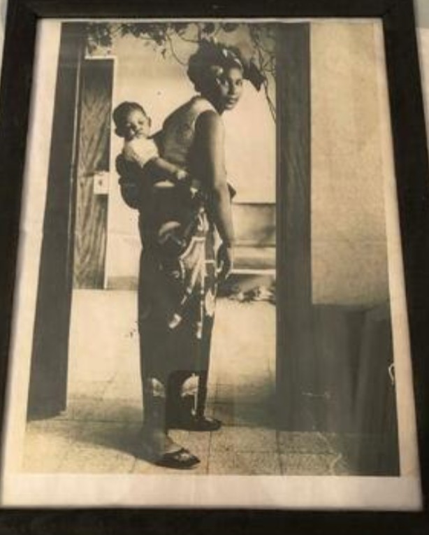 Mr Chapoteau as a baby carried by his mother during his time in Congo