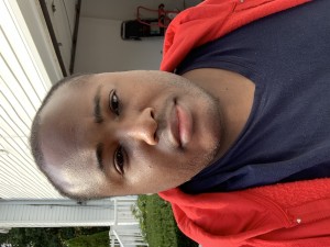 Earvin by his garage at home