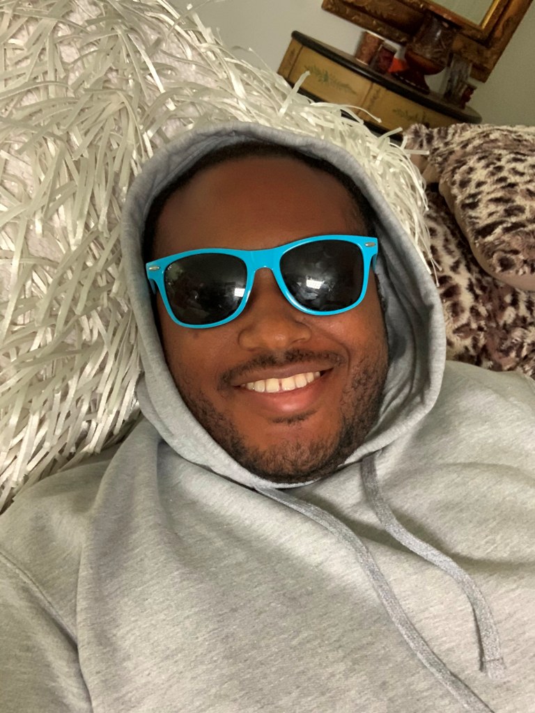 Earvin in his living room Earvin in his living room
