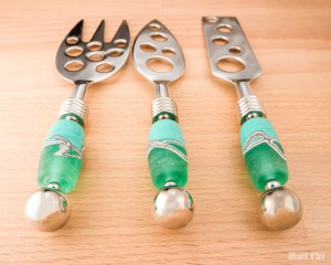 The three cheese knives with handmade glass beaded handles