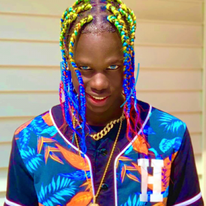 Rapper Kevin Da Savage with epic colorful hairstyle.