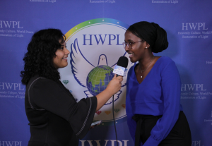Abigail Ponce from HWPL interviewing a representative from the Ethiopian Embassy 