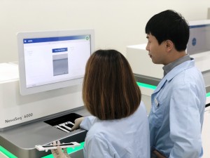 Staff operating the Illumina NovaSeq 6000