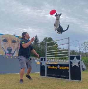Frisbee catch over the high jump.