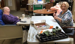 A patient at Center for Hope enjoys a light moment with a volunteer from St. Bartholomew Church