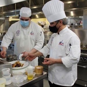 JJC Apprentice Jordan Gutierrez working with JJC Chef Paul Bringas