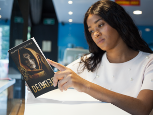 Deified by Bhanu Srivastav held by a girl