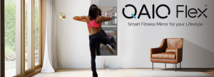A woman using QAIO Flex Fitness Mirror