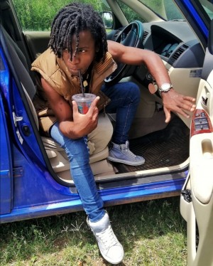 Jade Mario Posing with a sip on a summer afternoon