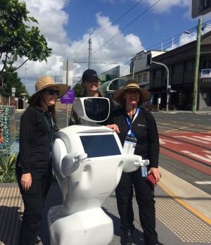 Promobot stopping to have photo taken by hundreds of poeple