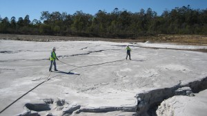 Workers at a power station treat fly ash dust in an ash pond with RSTs Total Ground Control