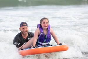 Big Smiles Surfing on the waves