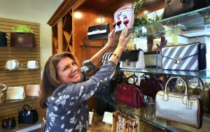 Karen checking on Kate Spade, Michael Kors, Coach and Tory Burch