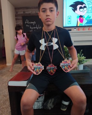 luke with his medals 2021