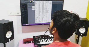 DJ ROOP making music in a studio