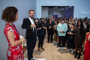 Mollie Dent Brocklehurst and Mikołaj Sekutowicz opening remarks at Secret Soirée | Photo: World Red Eye 