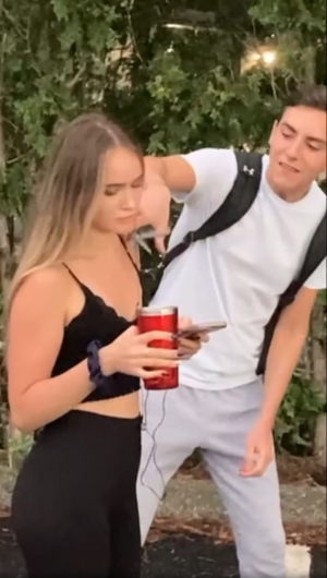 Nicholas Pinto cutting headphones