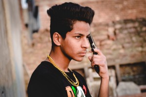 Lovish Saini with 9MM pistol