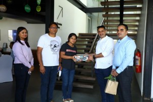 Customers receiving gift hamper from Rohit Cariappa Director Sales CRM Assetz Property Group