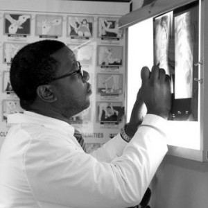 Dr. Jenkins, DC, CCEP examines an x-ray