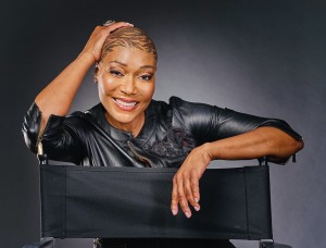 SEATED, SMILING, DIRECTORS CHAIR