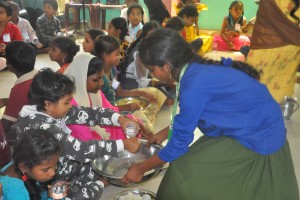smiley volunteers feeding lunch