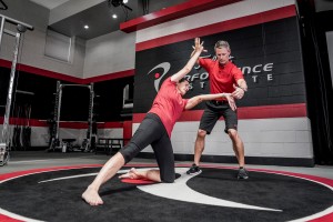 Dan Hellman and Janet Alexander demonstrate an ELDOA stretch at the PGA Teaching and Coaching Summit, January 21.