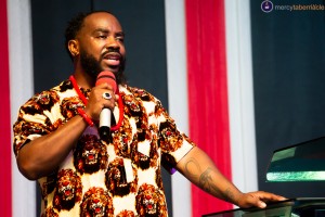 Victor Couzens on stage, Bishop Victor Couzens