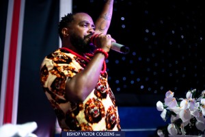 Victor Couzens on stage, Bishop Victor Couzens