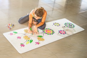 Drawing on the DIYogi yoga mat using markers and stencils