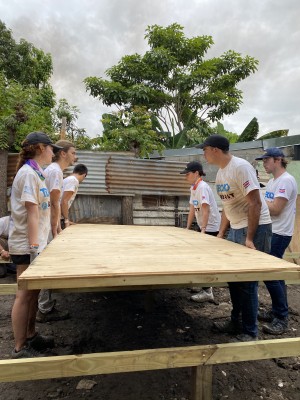 Volunteers installing the floor