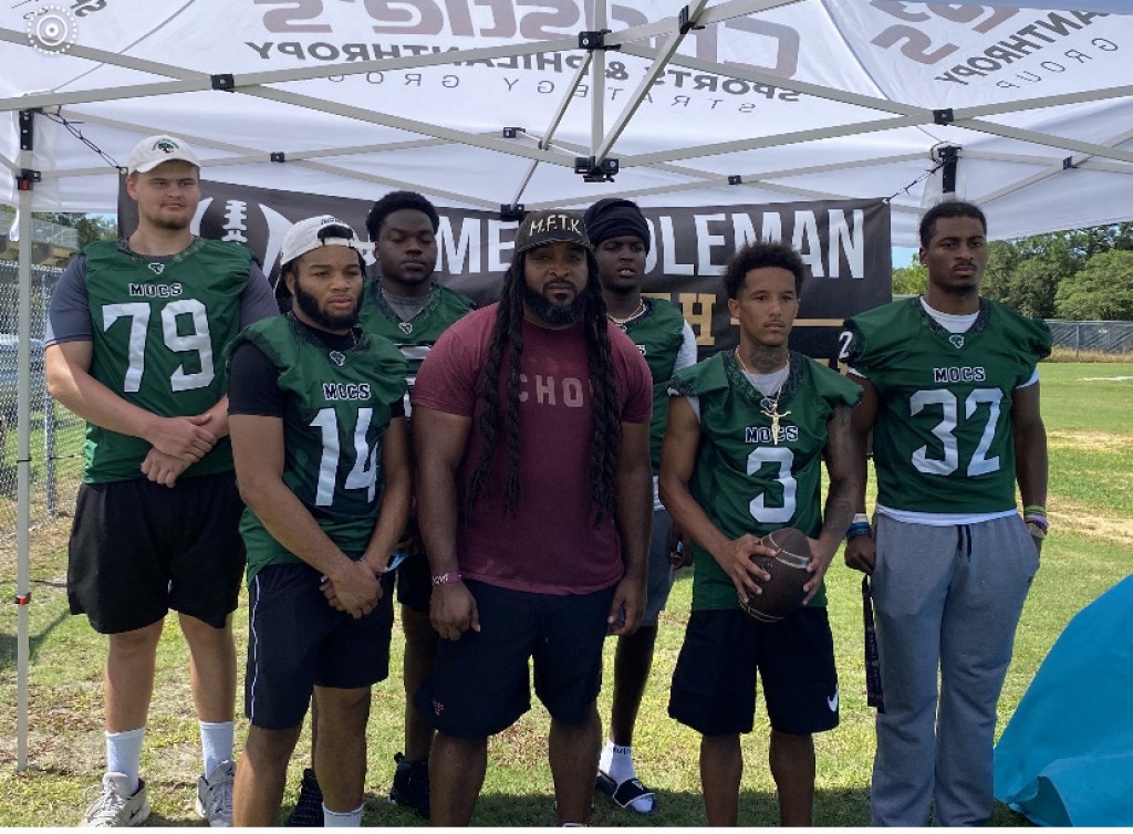 Jacksonville Athletic Academy Football Players Help at Local Football