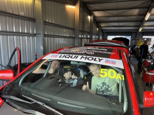 Jimmy gives race car tour to Izac, childhood cancer patient at QLD raceway