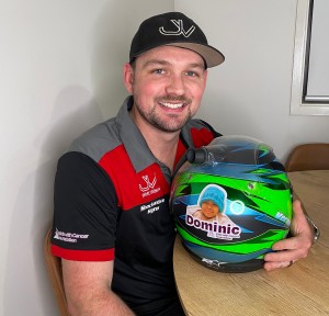 Jimmy with Dominic Ewings Sarcoma of the Sine patient on his helmet ready for the race this weekend