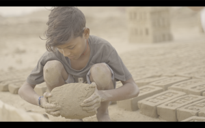 A child working at the brick factory 