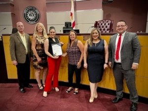 Pictured is Valeria Felciano with the Port St. Lucie city Council and Mayor