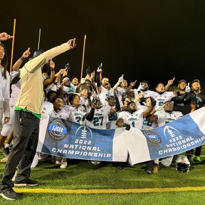Jacksonville Athletic Academy Moccasins holding the IJCAA National Championship Banner