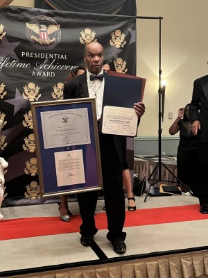 Kenya checks camera on set.